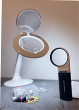 Load image into Gallery viewer, Halo magnifying lamp and Handheld round magnifier resting on a piece of fabric with sewing supplies.