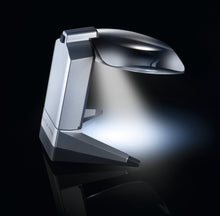Load image into Gallery viewer, Scribolux, large rectangular lens suspended off of support base with LED light, displayed over crossword