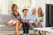 Load image into Gallery viewer, Man watching TV with MaxTV and his family