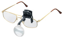 Load image into Gallery viewer, Monocular (circular) lens on black arm and clip, attached to glasses.
