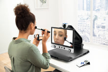 Load image into Gallery viewer, Woman using Vario DIGITAL 16 FHD advanced with mirror function to apply makeup.