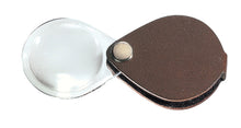 Load image into Gallery viewer, Circular magnifier inside clear oval setting, with attached fold-out brown case