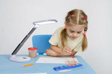 Load image into Gallery viewer, Young girl painting with Daylight's Foldi Go.