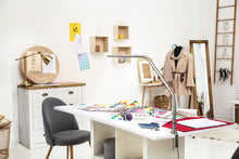 Load image into Gallery viewer, Fashion design studio with Slimline table lamp on a desk.