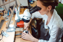 Load image into Gallery viewer, Jeweler using Slimline table lamp, along with a microscope.