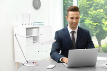 Load image into Gallery viewer, Daylight's Tricolour lamp on desk in office, with a man working.