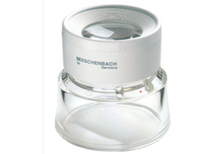 Load image into Gallery viewer, Small magnifier raised above work surface by clear stand.