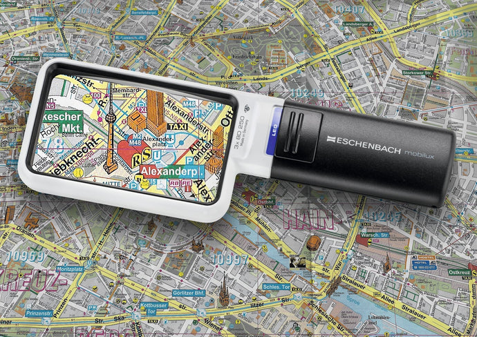 Mobilux LED, rectangular magnifier surrounded by white casing with a black handle and LED light switch.