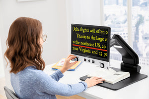 Young girl using Vario Digital FHD to read a book