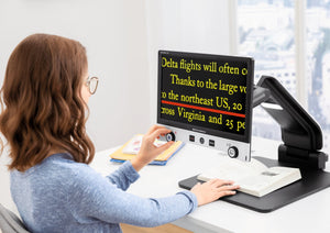 Young girl using Vario Digital FHD advanced to read a book