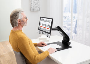 Man using Vario Digital FHD to read a document 