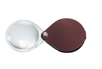 Load image into Gallery viewer, Circular magnifier inside clear oval setting, with attached fold-out burgundy
