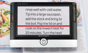 Visolux Digital HD being used to read a recipe from a book, with red reading line.