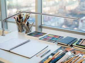 Slimline Table lamp on an arts and craft table.