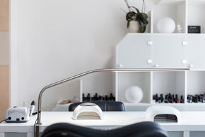 Slimline table lamp at a nail technician work station.