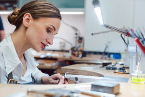 Jeweler using Slimline table lamp.