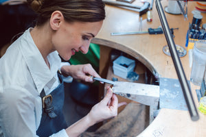 Jeweler using Slimline table lamp.