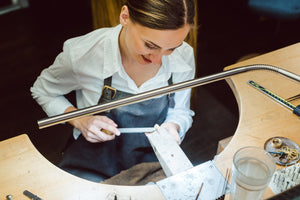 Jeweler using Slimline table lamp.