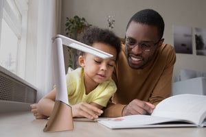 Parent and child reading with aid of Smart Go