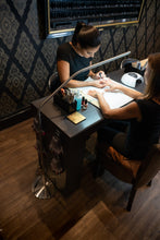 Load image into Gallery viewer, Daylight&#39;s Slimline Floor-standing lamp being used in a nail salon.
