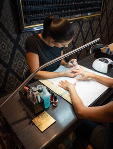 Daylight's Slimline Floor-standing lamp being used in a nail salon.