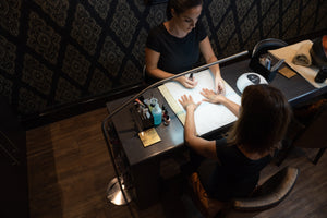 Daylight's Slimline Floor-standing lamp being used in a nail salon.